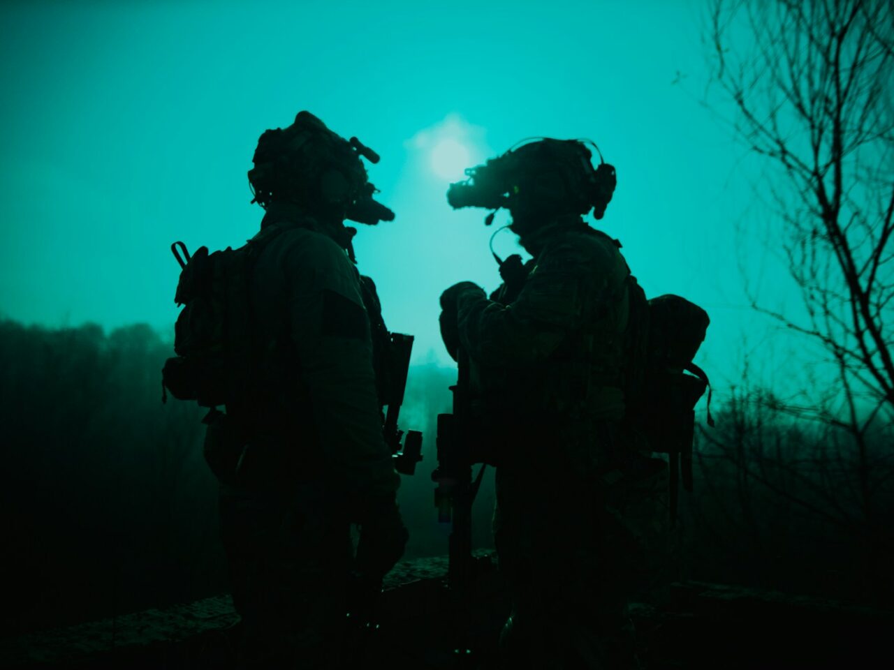 a couple of soldiers standing next to each other